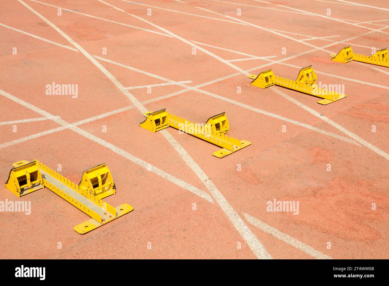 Starting blocks in the plastic on the playground Stock Photo - Alamy