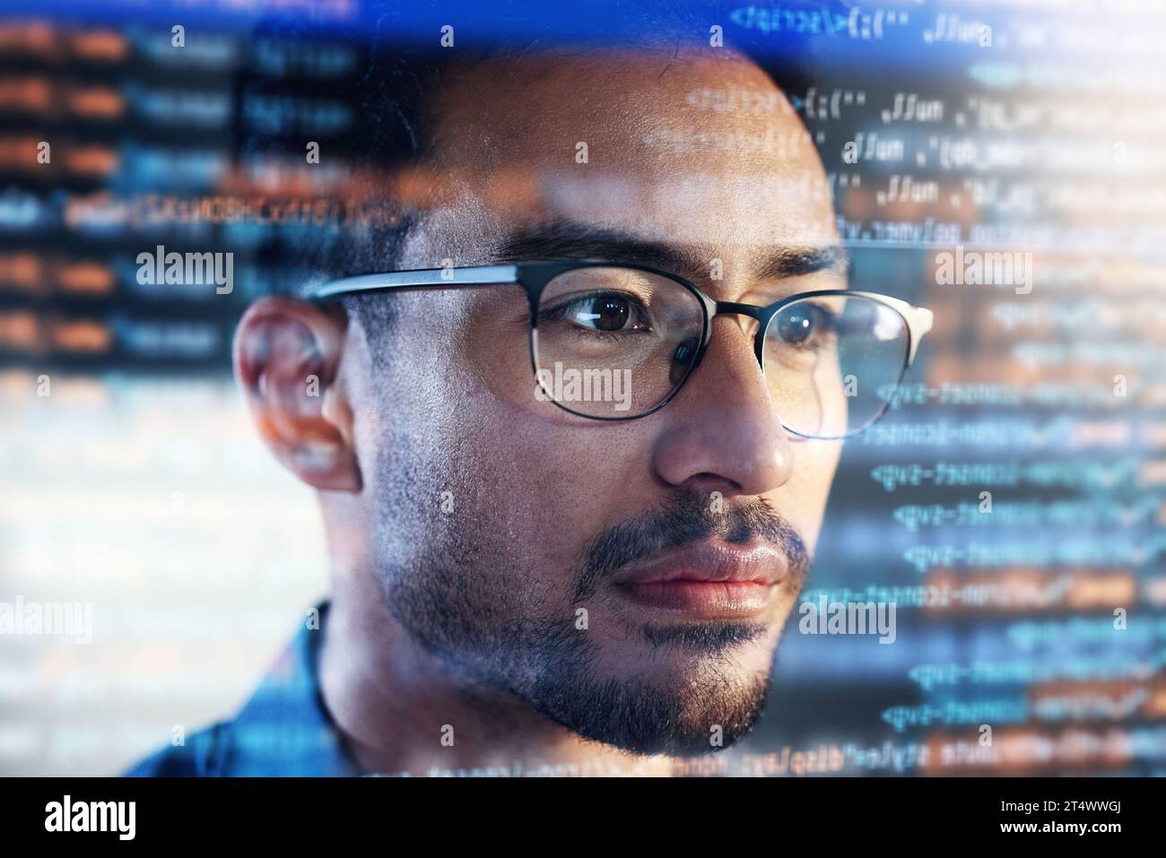 Asian man, face and programming at night with overlay or dashboard of code, malware or software at office. Male person, coder or programmer working Stock Photo