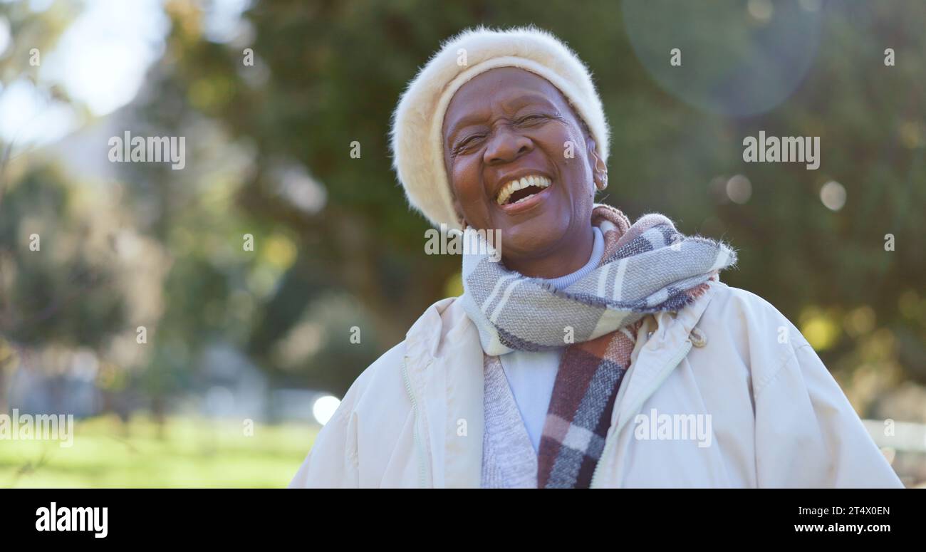 Face, smile and a senior black woman laughing outdoor in a garden during summer for freedom or energy. Nature, environment and happy with a funny Stock Photo