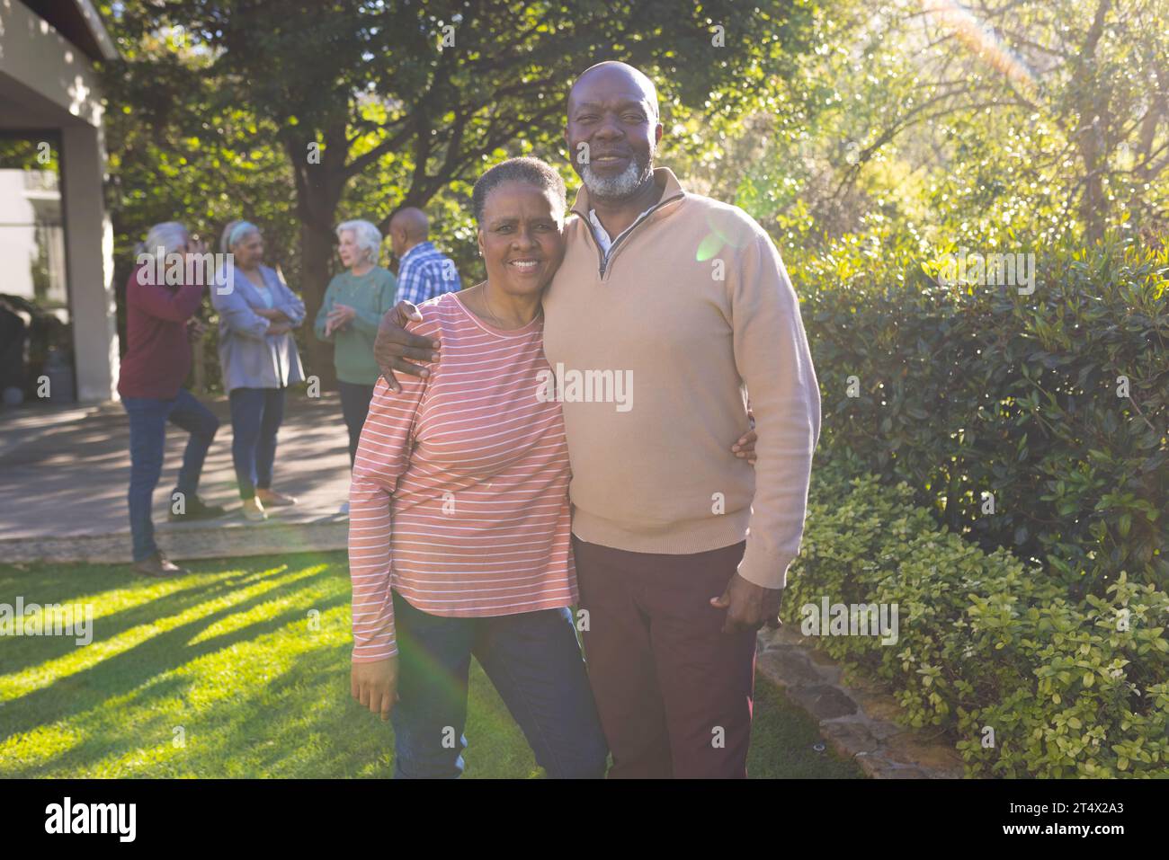 Happy african american couple of senior friends embracing and smiling ...