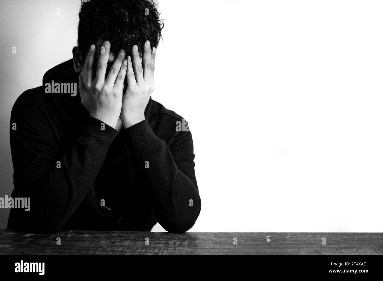 Portrait of Depressed Asian Man hiding his face with hands. Stressed, Hopeless, Frustration, Mental disorder, Broken heart and Psychological problems. Stock Photo