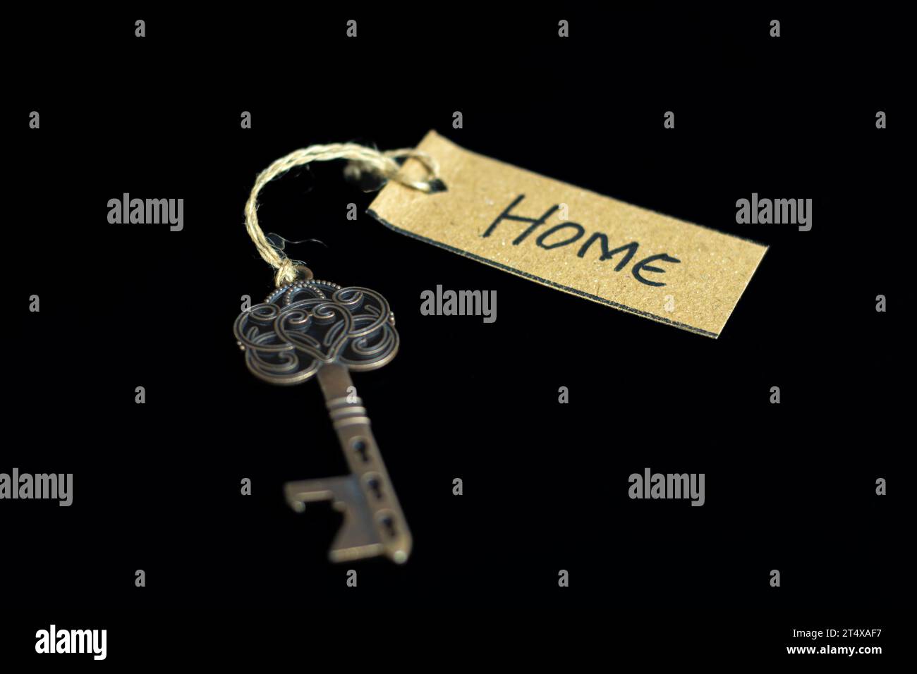 Old decorative key and handwritten tag