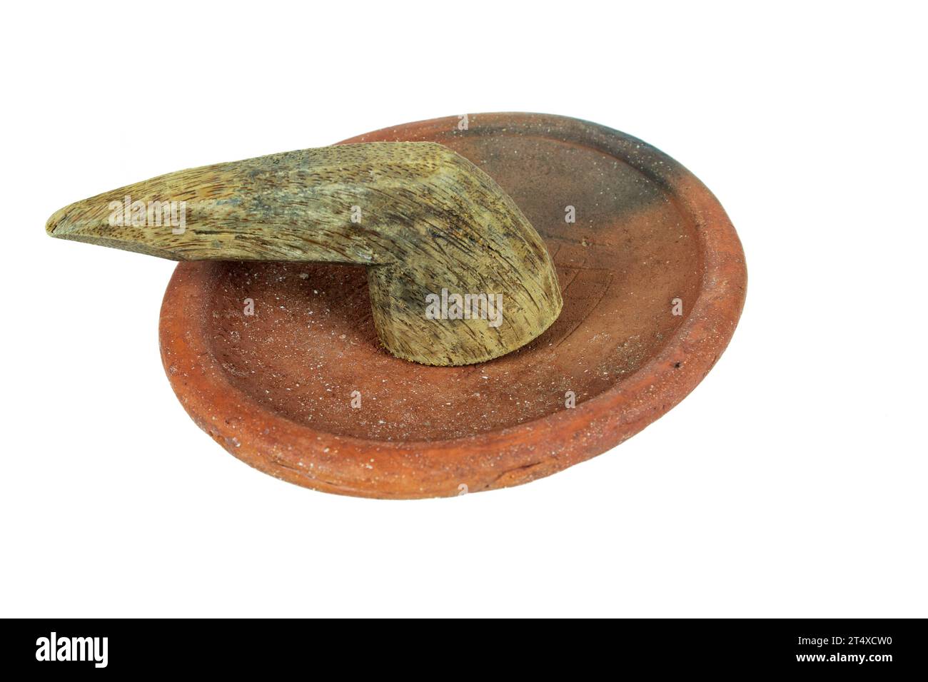 Traditional mortar and pestle made of clay and wood on a white