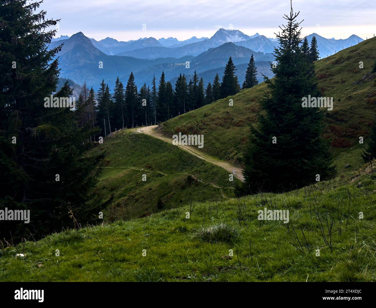 Hiker walking up to Edelsberg peak with Sportheim Böck mountain hut and a view on Zugspitze mountain in Nesselwang, Germany, Oct 17, 2023. Credit: Imago/Alamy Live News Stock Photo