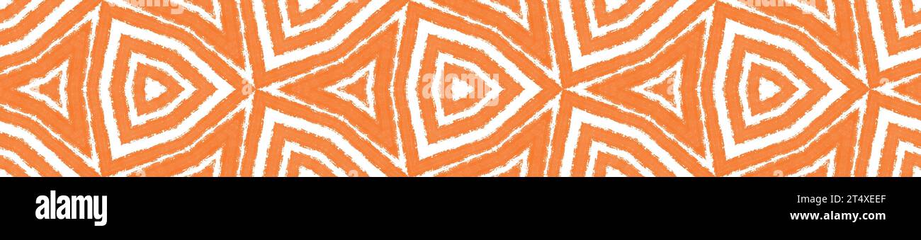Ikat repeating seamless border. Orange symmetrical kaleidoscope background. enchanting decorative design element for background. Summer ikat sweamwear Stock Photo