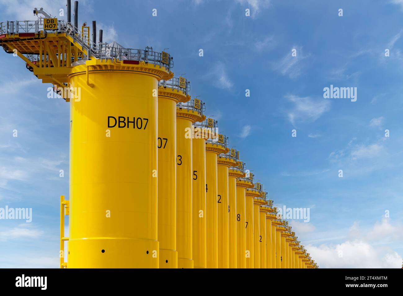 Rotterdam, the Netherlands-September 16, 2023; Low angle view of yellow transition pieces on construction site of SIF company a steel tubular manufact Stock Photo