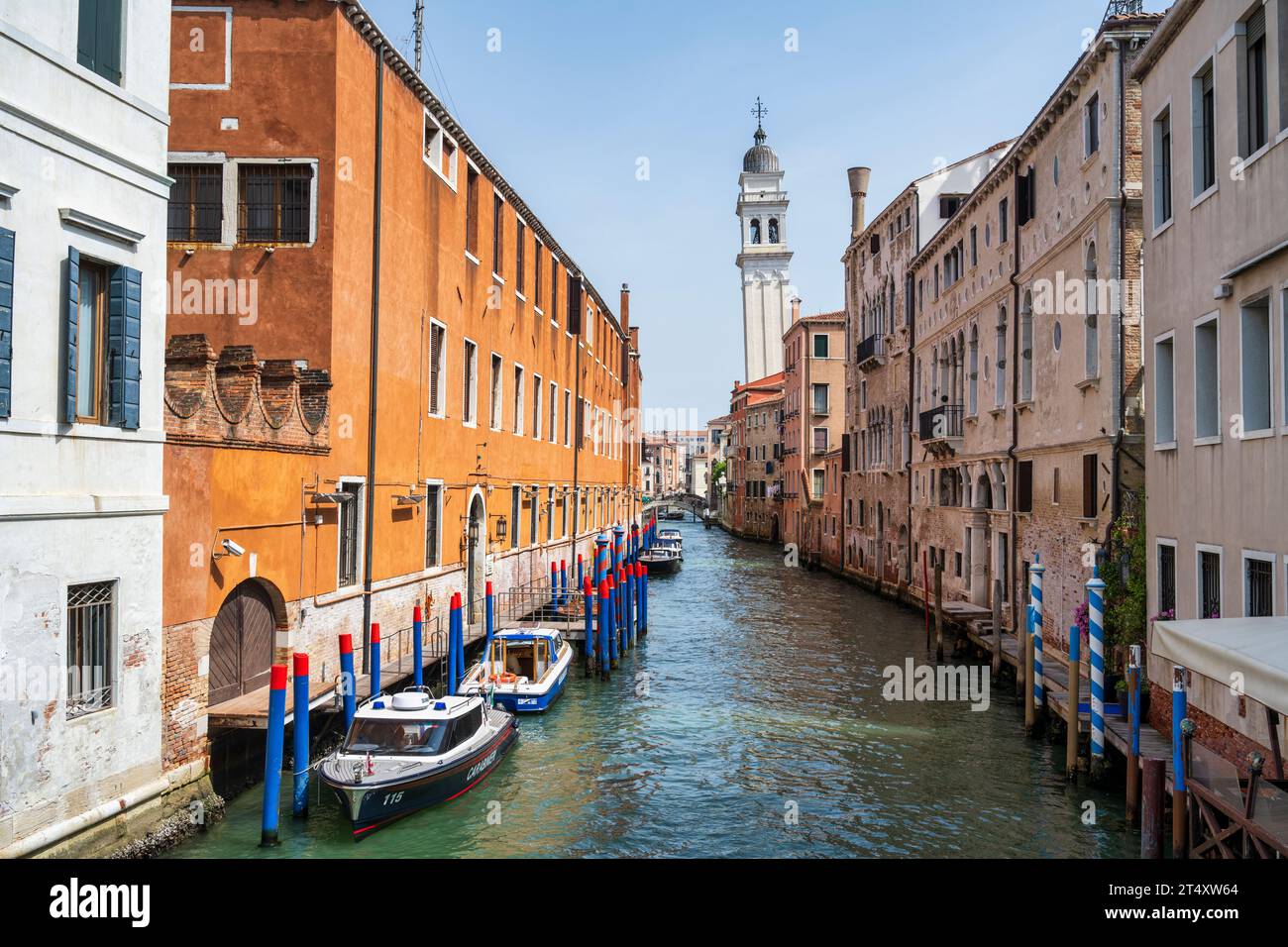 View of Rio dei Greci canal from Ponte de la Pieta, with leaning bell tower of Chiesa di San Giorgio dei Greci beyond in Venice, Veneto Region, Italy Stock Photo