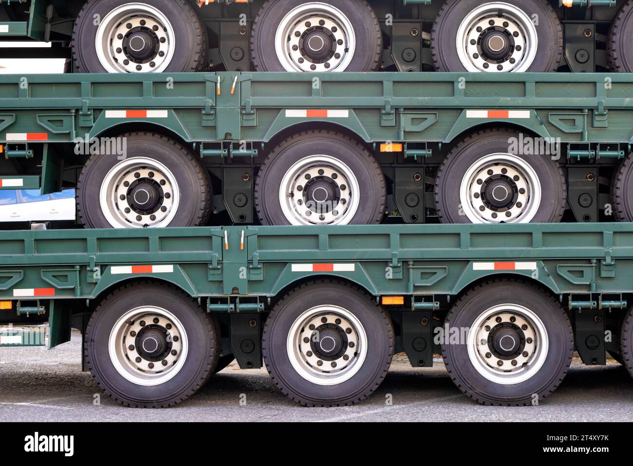 Close-up of wheeled trailer platforms stacked on top of each other for trucks. Copy space. Stock Photo