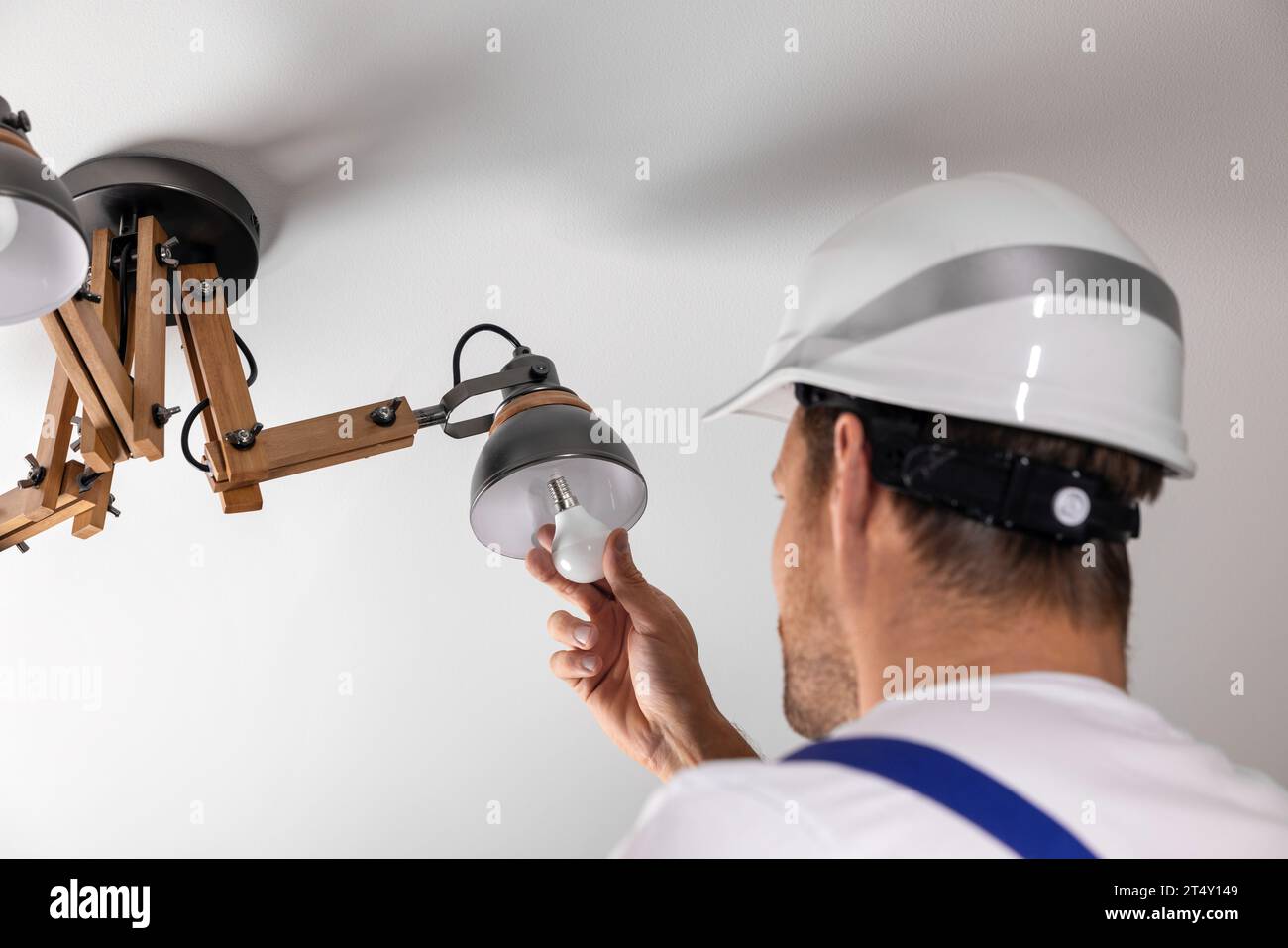 Ceiling bulb man hi-res stock photography and images - Alamy
