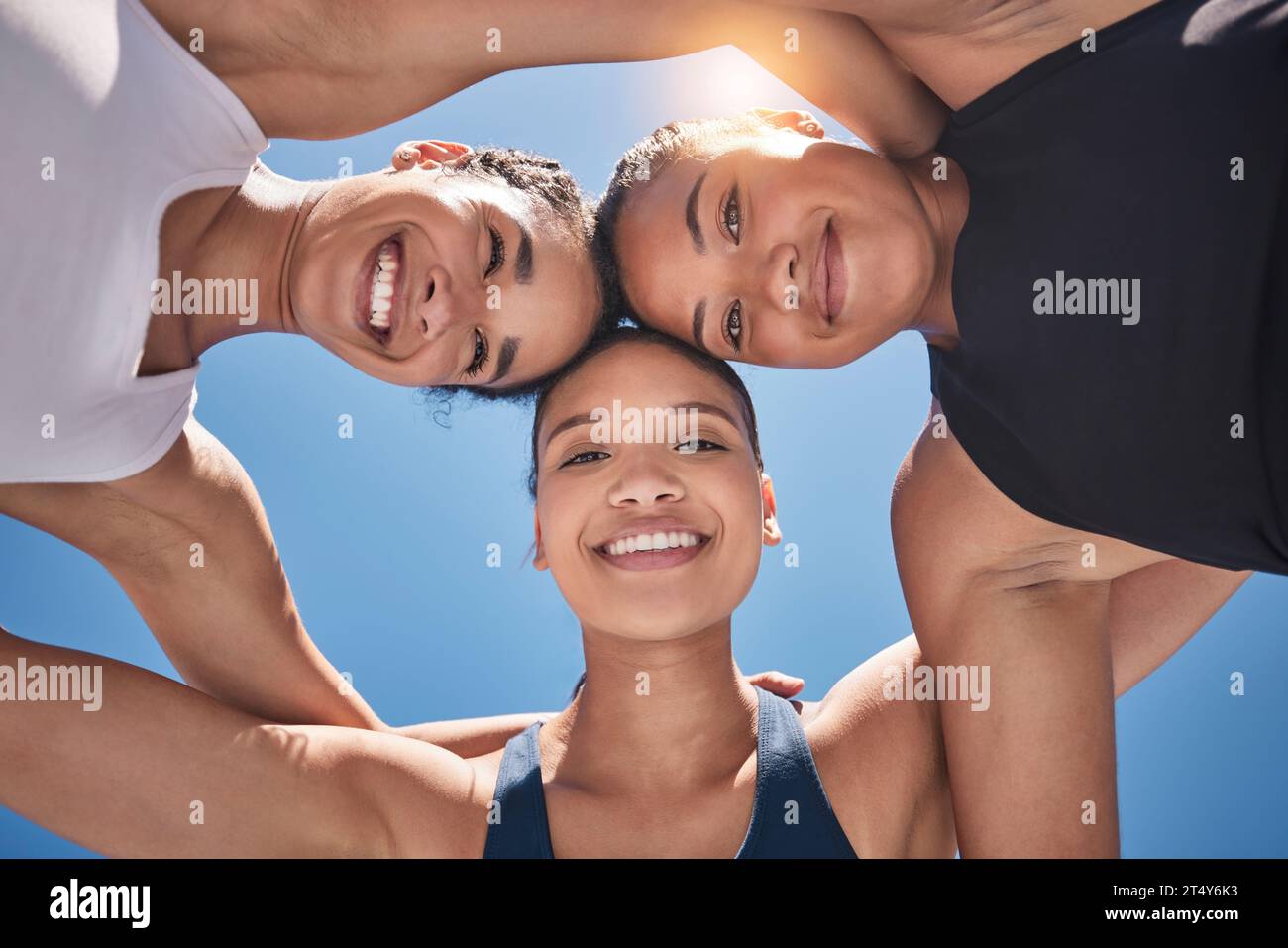 Fitness, friends and portrait of athletes from below at an outdoor marathon, training or practice. Sports, team and healthy happy women doing exercise Stock Photo