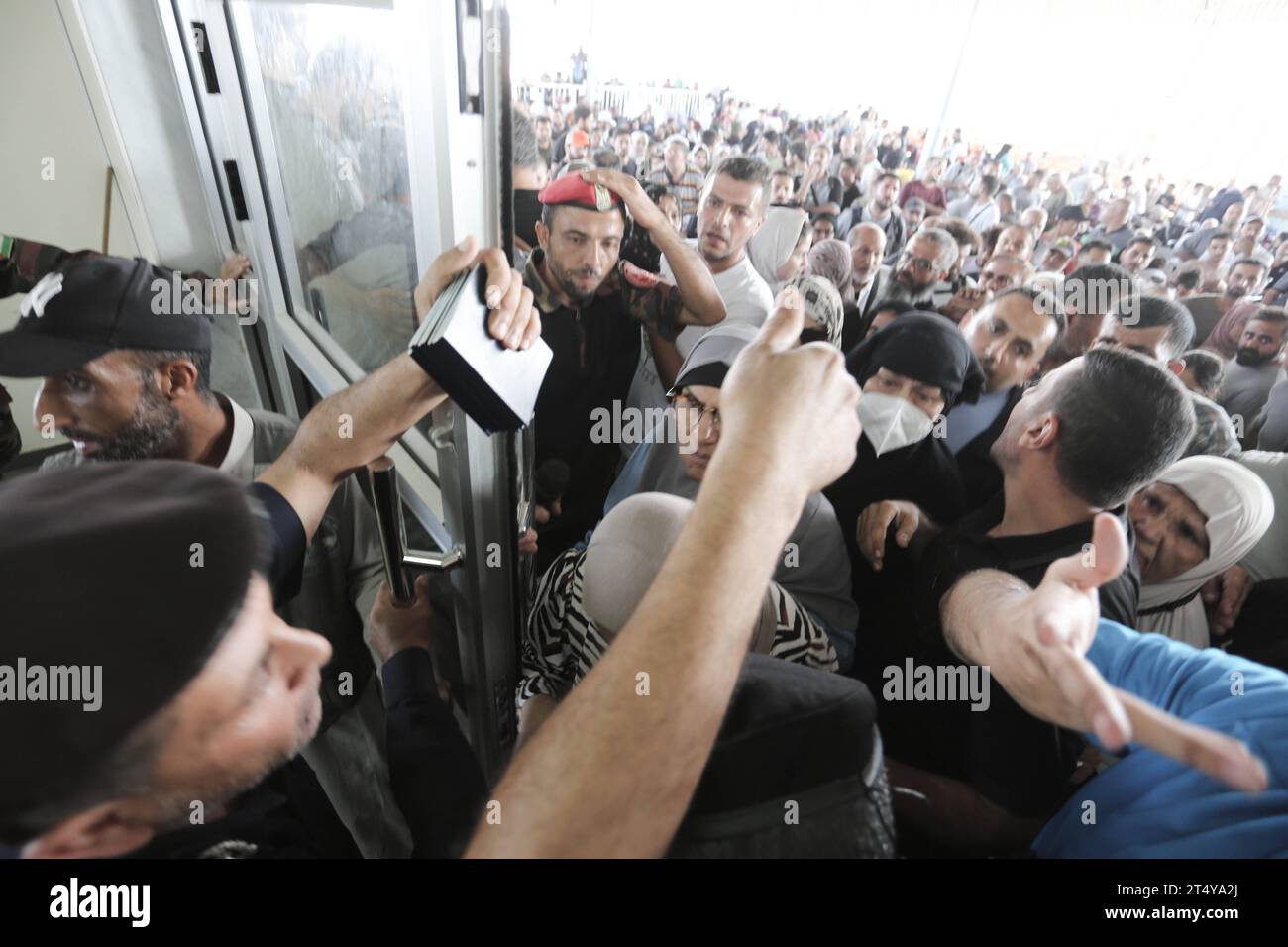 People Walk Through A Gate To Enter The Rafah Border Crossing To Egypt ...