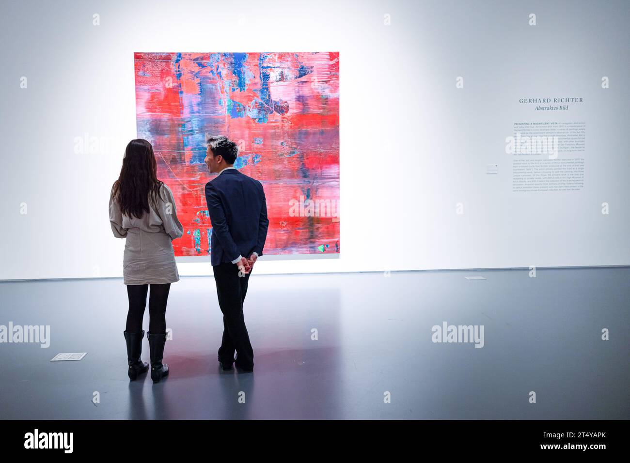 New York, USA. 01st Nov, 2023. Two attendees of Sotheby's Marquee Week Auction Preview chat and admire the piece 'Abstraktes Bild' by Gerhard Richter on November 1, 2023 in New York, NY. (Photo by Hailstorm Visuals/SIPA USA) Credit: Sipa USA/Alamy Live News Stock Photo