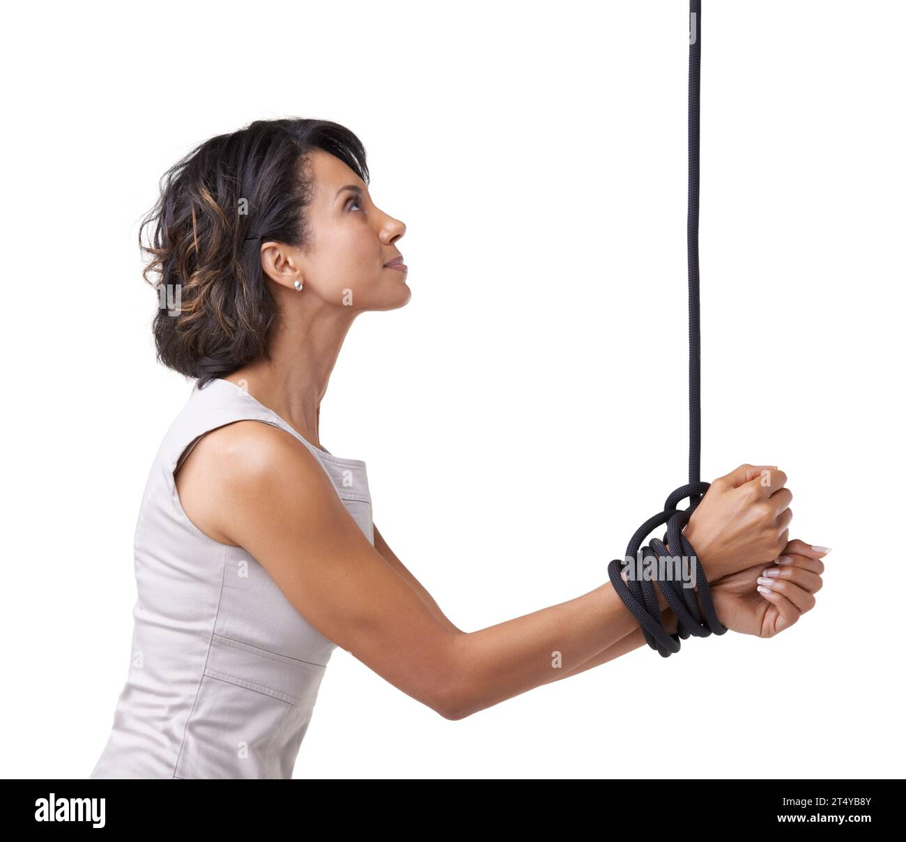 Woman, business and hands for tied up with rope on white background, studio or mock up in corporate slavery. Person, hostage or prisoner for Stock Photo