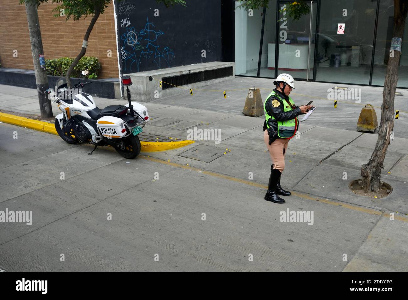 Motorcycle Police Officer at the roadside. Lima, Peru. Stock Photo