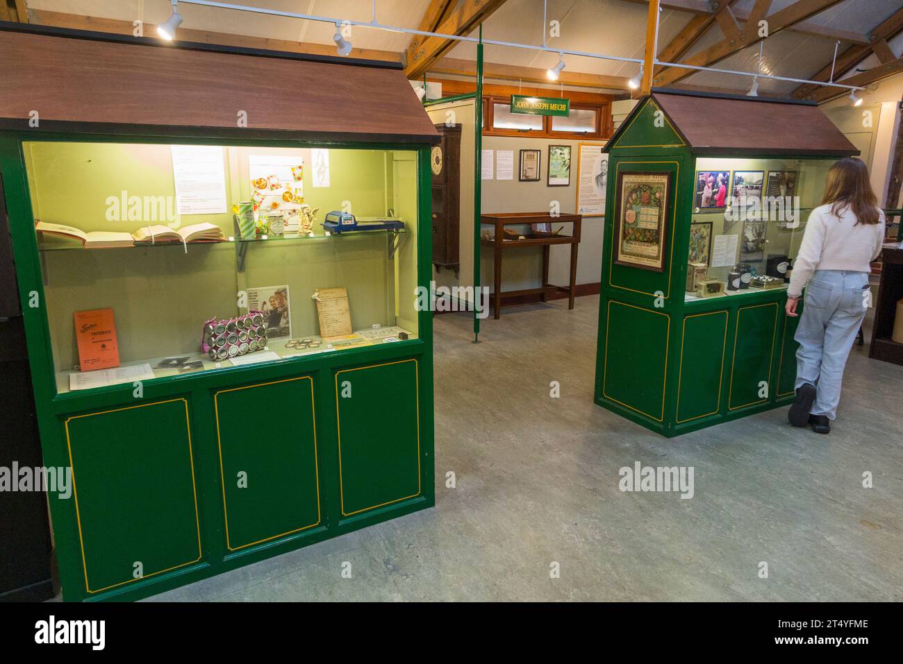 Girl child / kid / kids / children visiter look at display inside interior of the Jam Museum at Wilkin & Sons Limited in Tiptree, Essex, UK. (136) Stock Photo