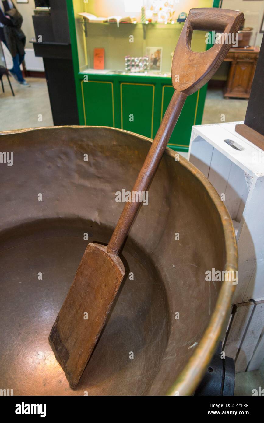 Jam boiling pan & wooden paddle (stirring) in the Jam Museum at Wilkin & Sons Limited, manufacturer of preserves since 1885, Tiptree, Essex, UK. (136) Stock Photo