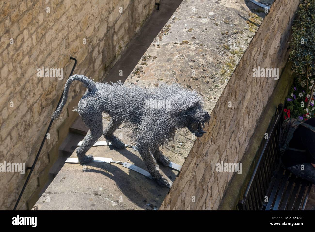 Sculpture of a monkey made of metal wire on the ramparts of the Tower