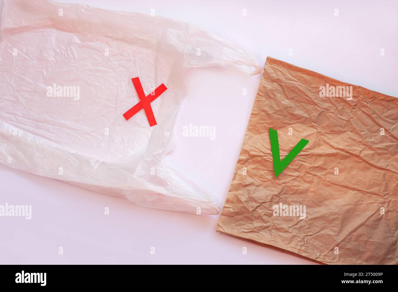 Blank plastic bag vs brown recyclable paper pack. Say no to plastic