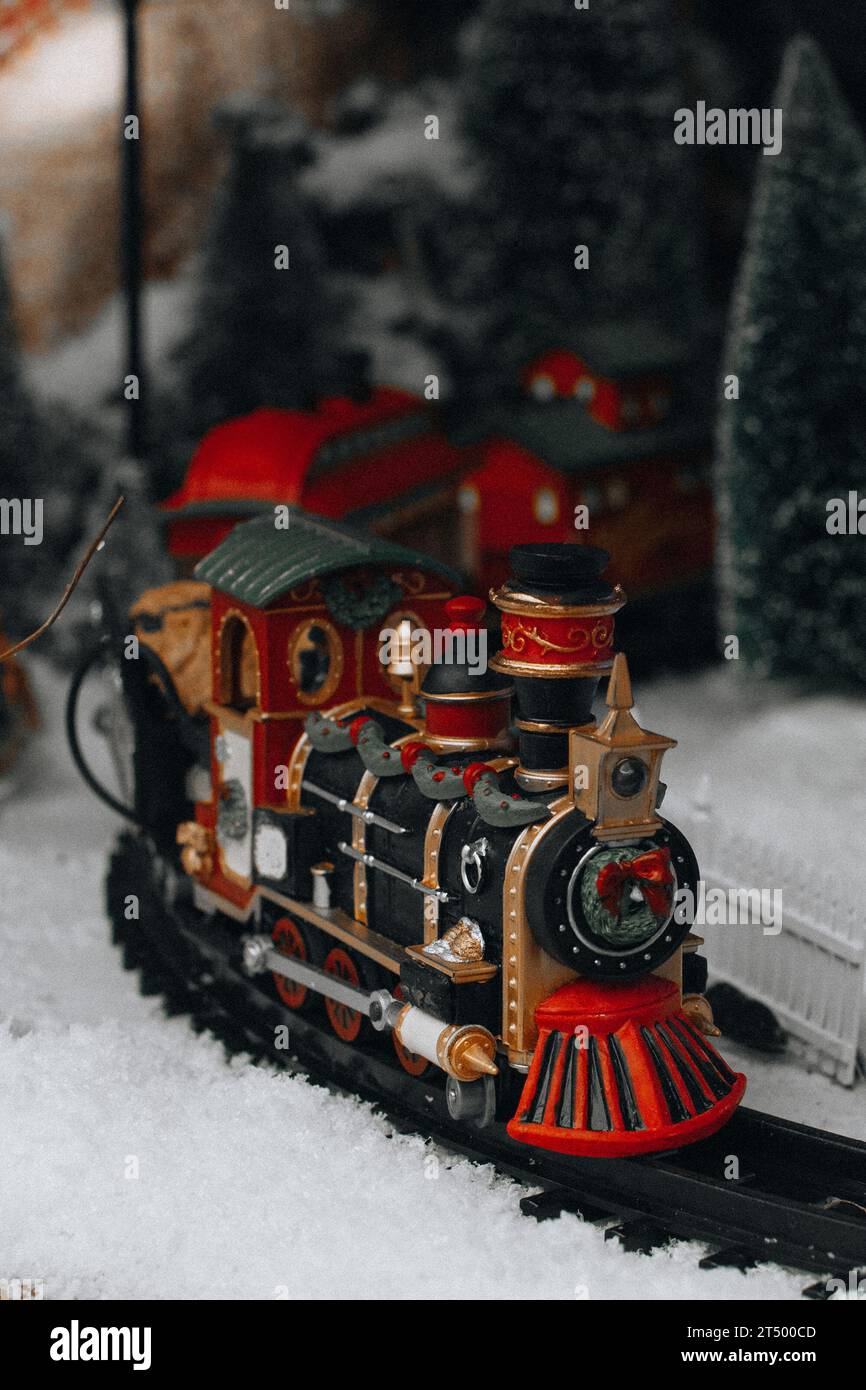 Famous New Year and Christmas toys decorations with Christmas tree, snow and train. Vintage gifts and decorations for the winter holidays Stock Photo