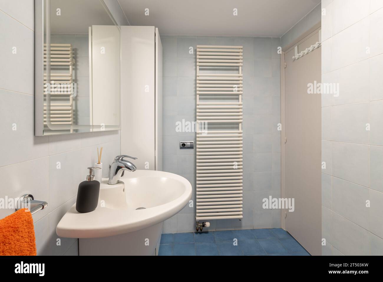 Vanity Over Radiator Radiator and cabinet in modern bathroom with vanity area Stock Photo ...
