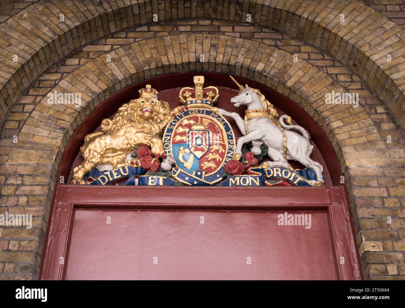 Closeup of the Royal Crown, Dieu et Mon Droit, and Lion and the Unicorn outside Theatre Royal Drury Lane, London, England, U.K. Stock Photo