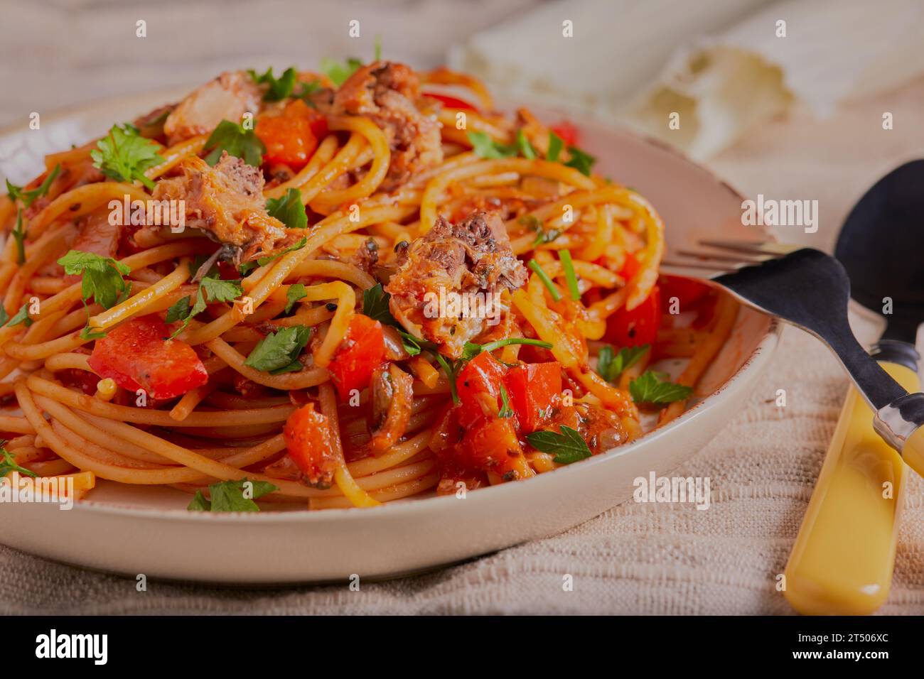 Sardines and pasta dish with vegetables and herbs. Stock Photo
