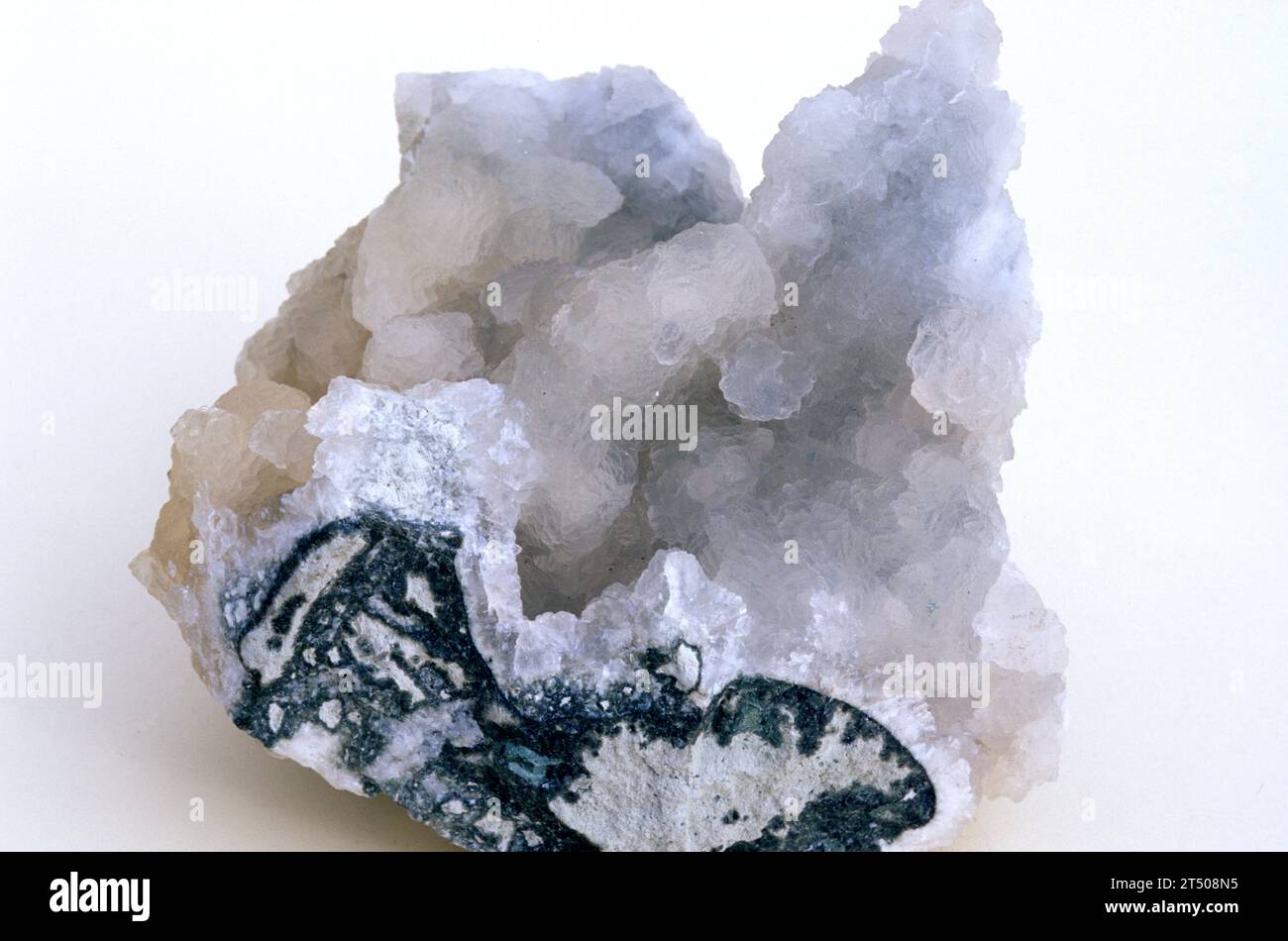 Prehnite is a calcium aluminium silicate mineral. Crystallized sample. Stock Photo