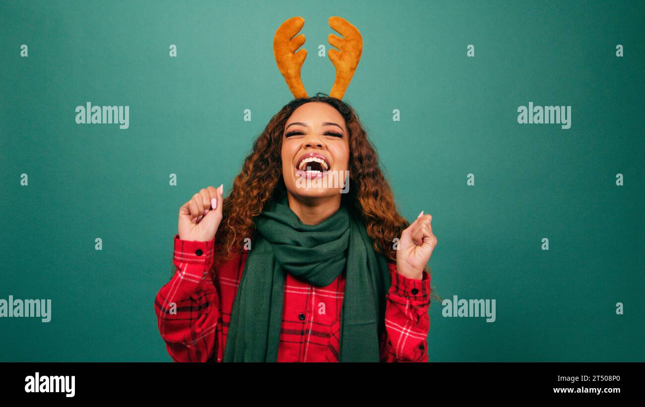 Excited young woman jumps hi-res stock photography and images - Alamy