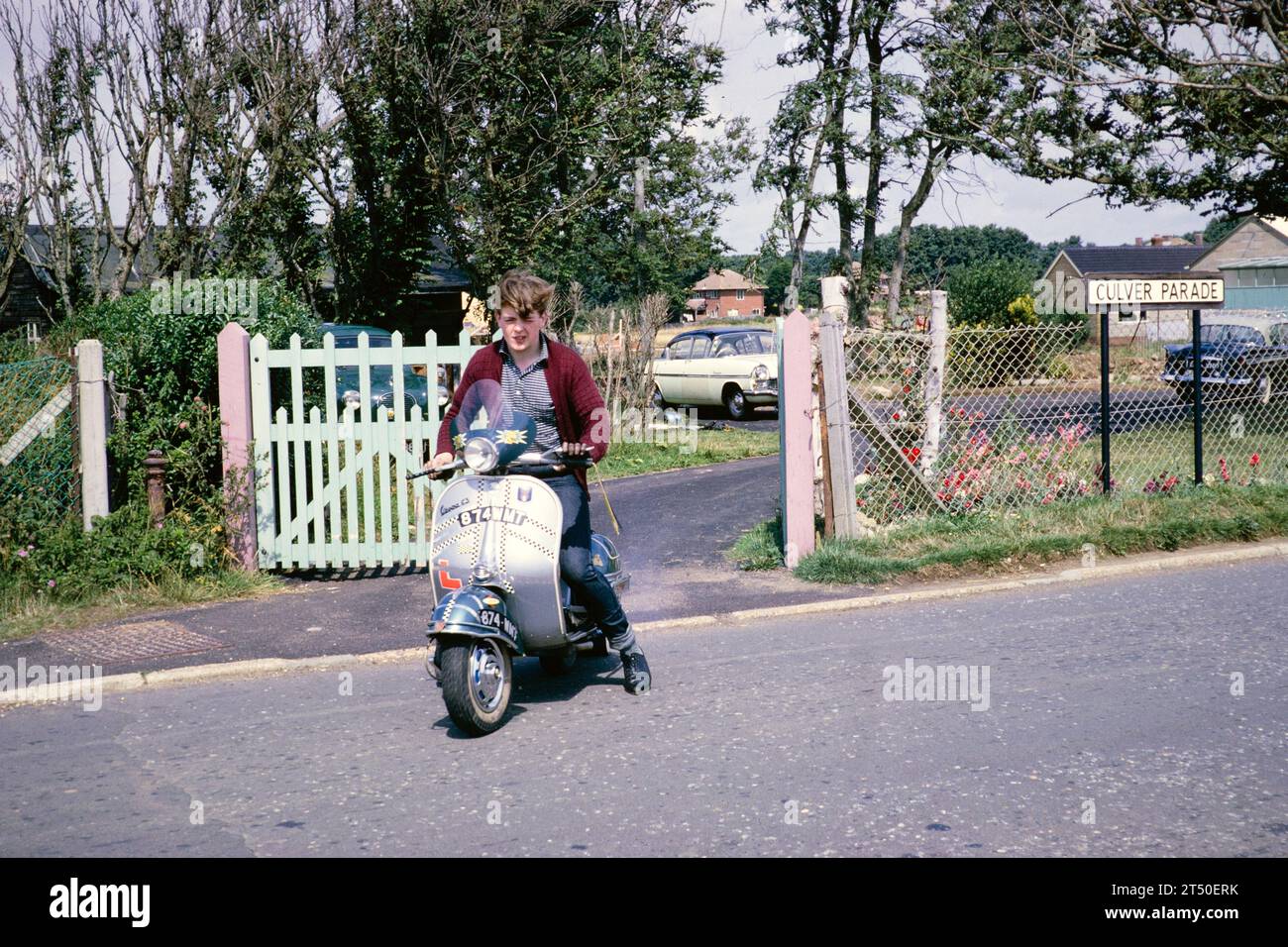 Teenage boy riding Vespa GS motor scooter without helmet, Culver Parade, Sandown, Isle of Whight