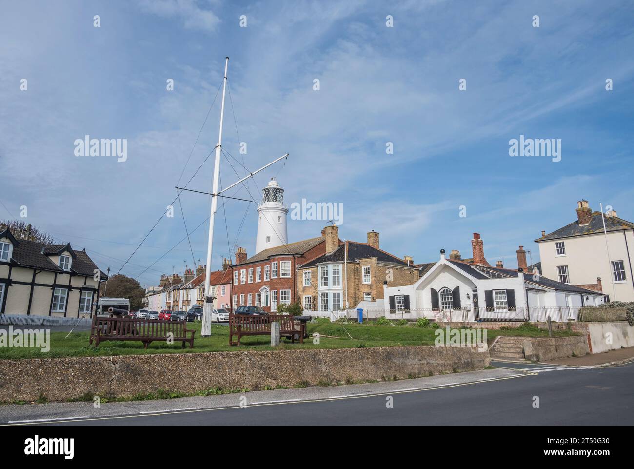 The image of the Flagpole Green with Southwold lighthouse at the coastal resort town of Southwold or is it Southwold on Sea in the county of Suffolk Stock Photo