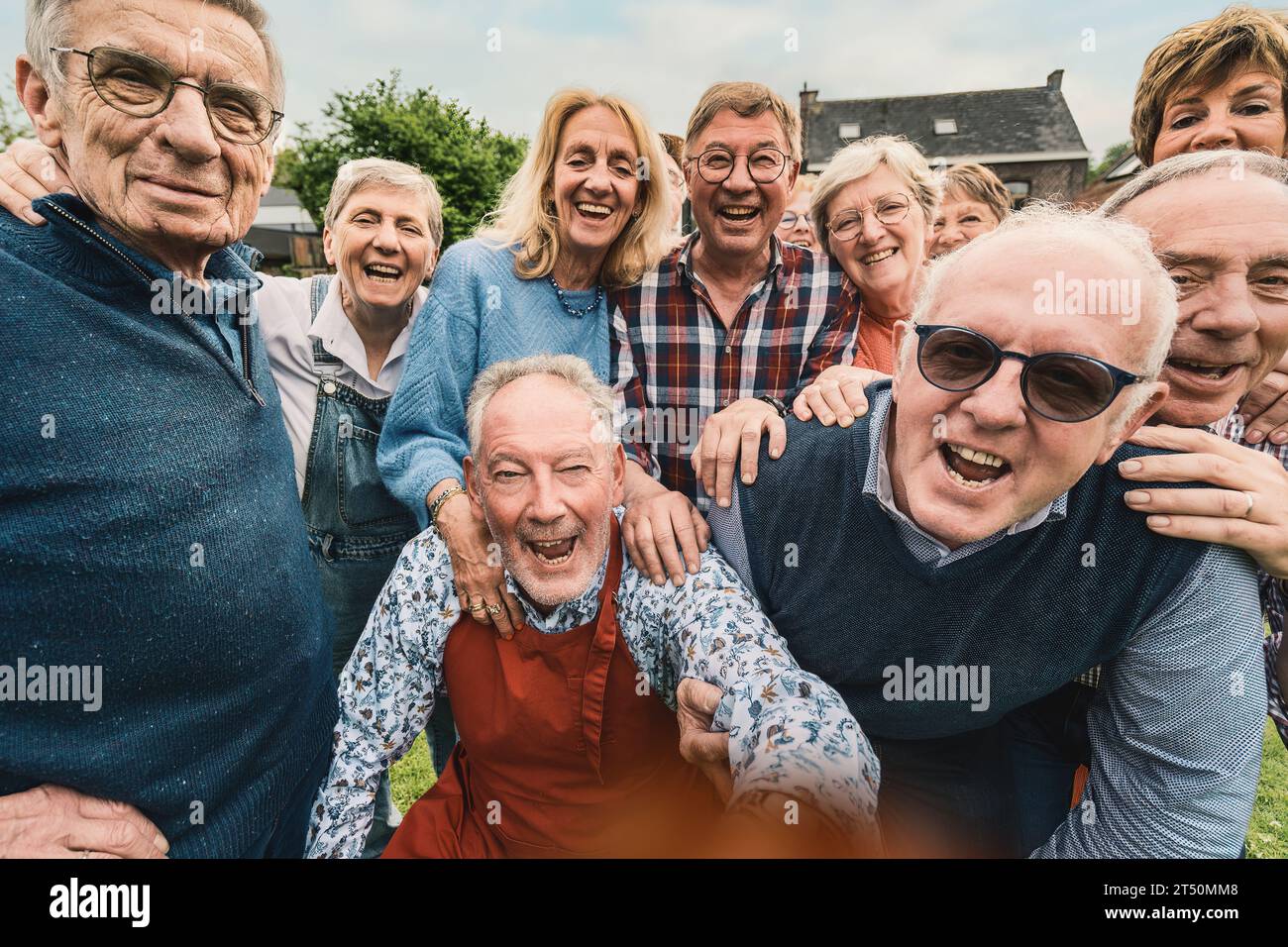 A lively group of senior citizens are caught in a candid moment of pure