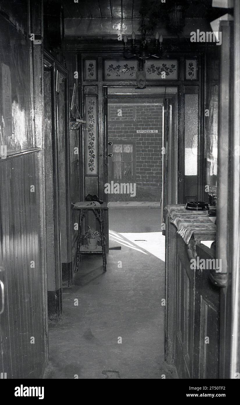 1960s, inside view of the decorative wood panelled entrance and small bar - on the right of the picture - at The Bulls Head pub on the Ripponden Rd, Oldham, England, UK, a Wilsons public house. The pub closed in 2015. Stock Photo