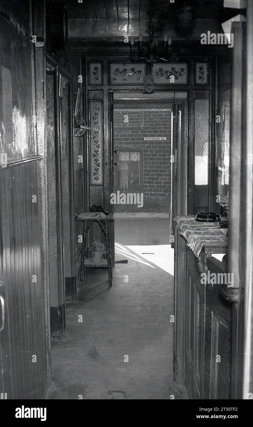 1960s, inside view of the decorative wood panelled entrance and small