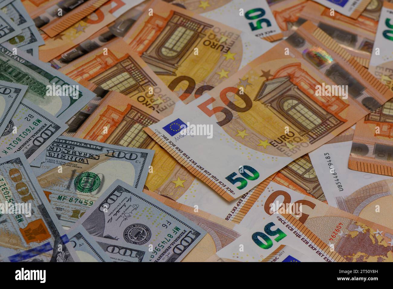 50 euro and 100 dollar bills mixed on the table, studio filming 10 Stock Photo