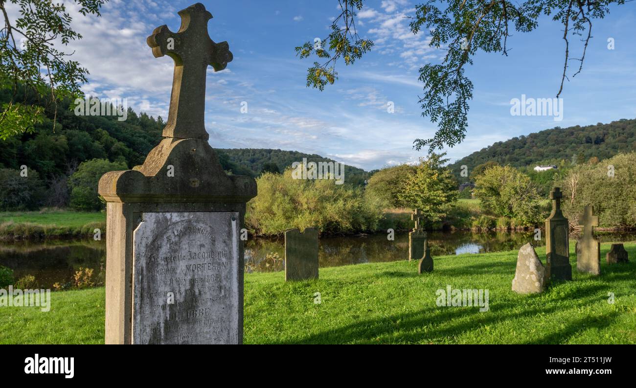 Le Vieux Cimetière, old cemetery along the Semois river with 16th and 17th century tombstones in the village Mortehan, Bertrix, Luxembourg, Belgium Stock Photo