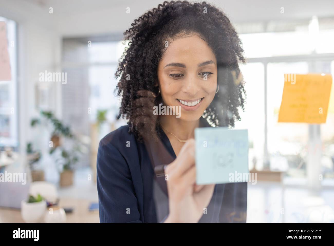 Positive black lady planning hi-res stock photography and images - Alamy