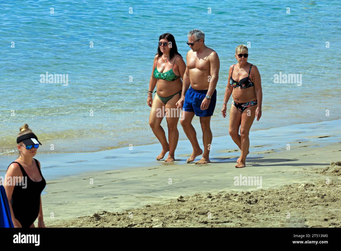 People enjoying Playa Dorada beach, Lanzarote. Taken March 2023 Stock Photo