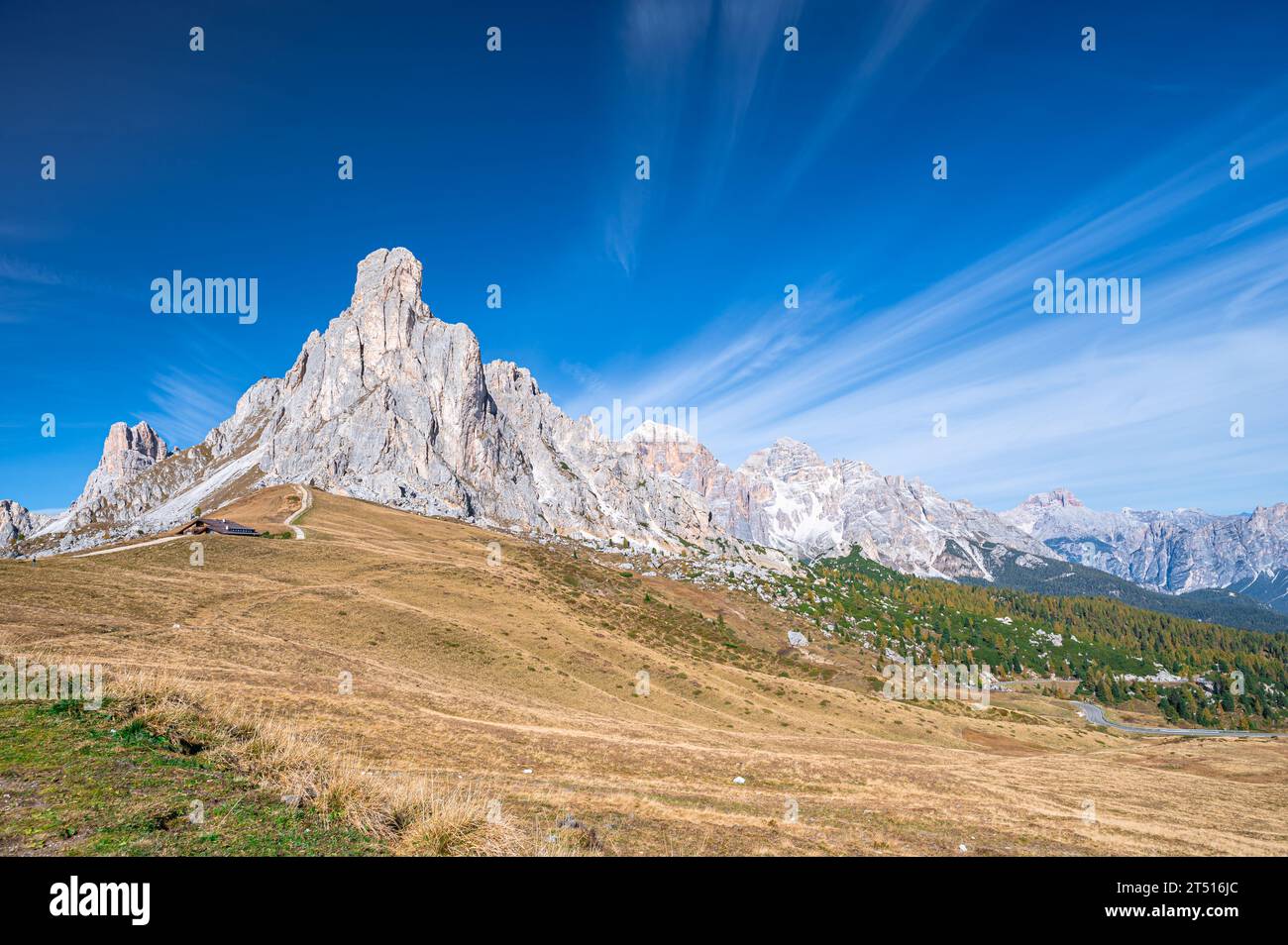 Beautiful view of a mountain in the Dolomites with streaking cirrus clouds above Stock Photo