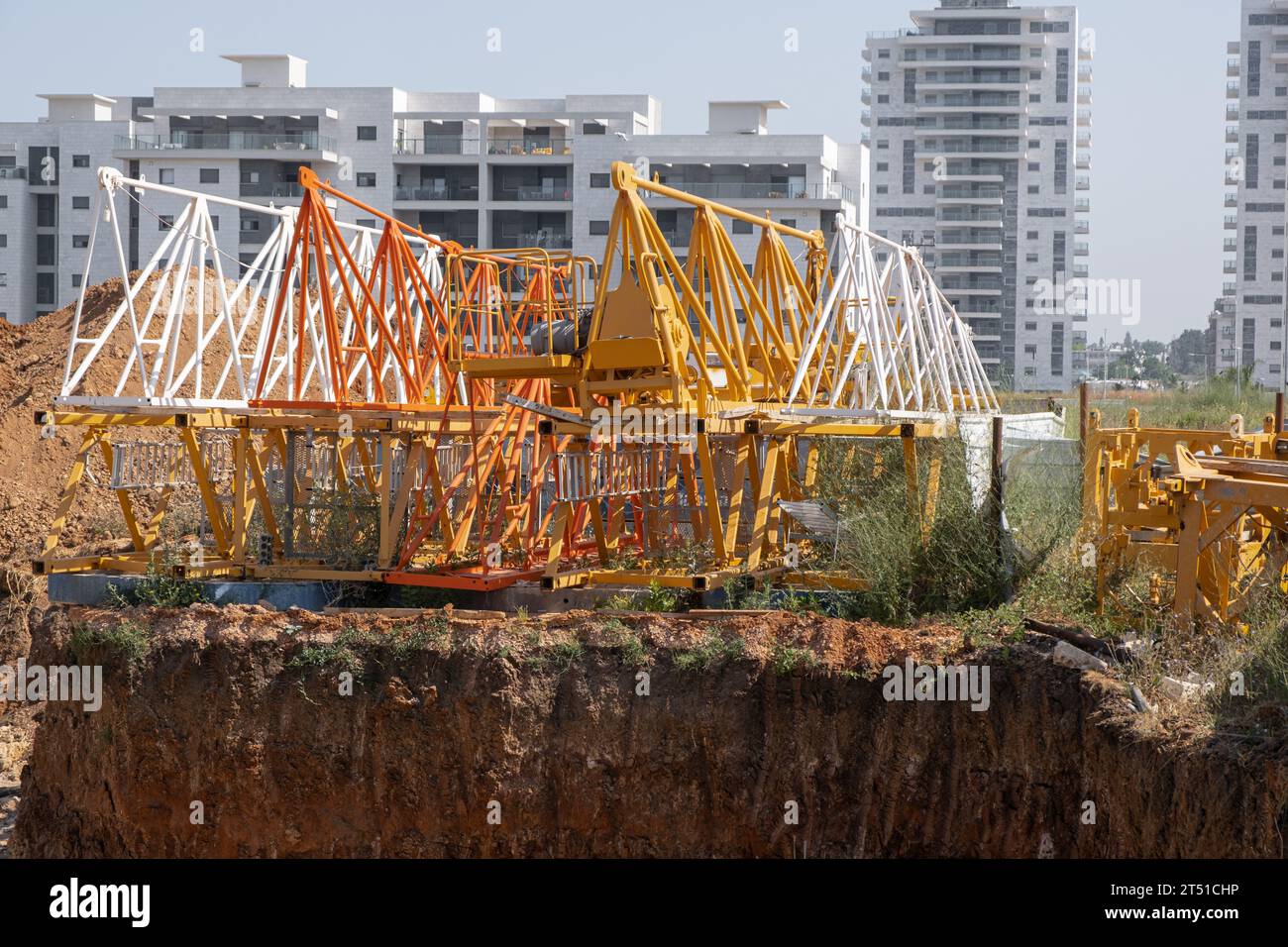 dismantled construction crane for installing, backdrop of an finished
