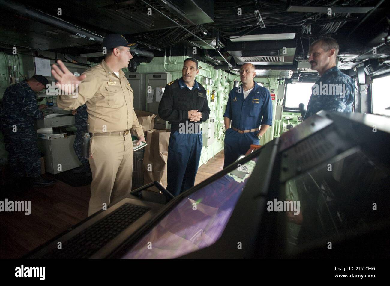 1007015319A-053 PACIFIC OCEAN (July 1, 2010) Cmdr. Jeffrey Oakey, left, commanding officer of the amphibious transport dock ship USS New Orleans (LPD 18), gives a tour of the ship’s bridge to Cmdr. Scott Smith, commanding officer of the guided-missile frigate USS Klakring (FFG 42), and Capt. Brian Nickerson, commodore of Destroyer Squadron (DESRON) 40, during Southern Partnership Station 2010. New Orleans is participating in Southern Partnership Station, an annual deployment of U.S. military training teams to the U.S. Southern Command area of responsibility. Navy Stock Photo