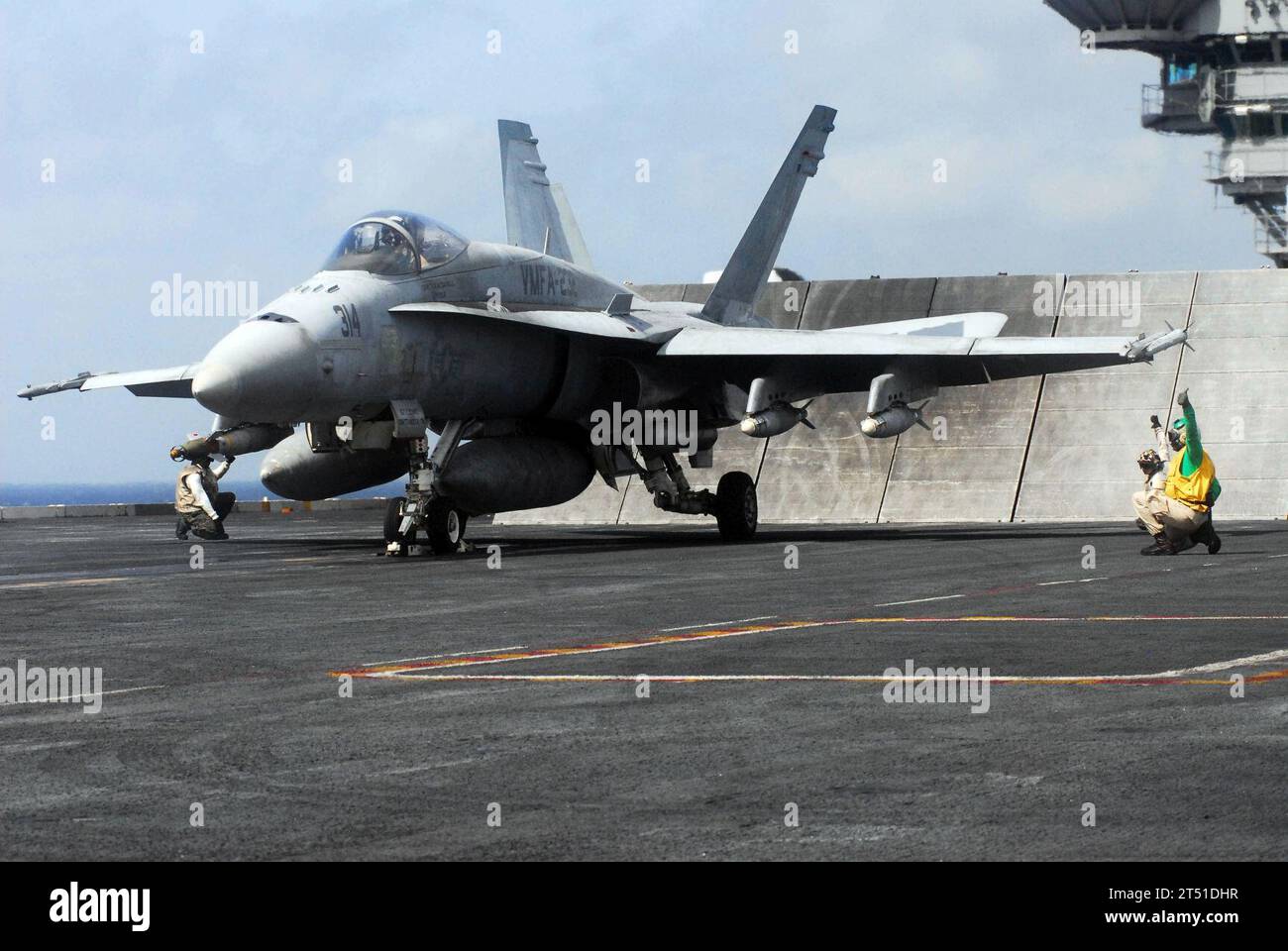 0705156326B-022 INDIAN OCEAN (May 15th, 2007) - Sailors prepare to launch an F/A-18A Hornet assigned to the 'Red Devils' of Marine Fighter Attack Squadron (VMFA) 232 off the flight deck of the nuclear-powered aircraft carrier USS Nimitz (CVN 68). The Nimitz Carrier Strike Group and embarked Carrier Air Wing (CVW) 11 are deployed in the U.S. 5th Fleet area of operations conducting Maritime Security Operations and supporting troops participating in Operation Enduring Freedom. U.S. Navy Stock Photo