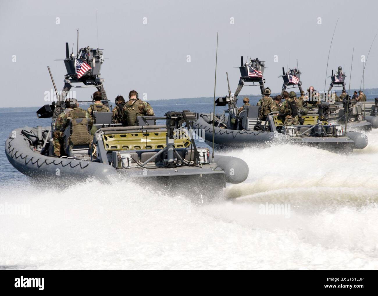 0809034500G-090 PINEY ISLAND, N.C. (Sept. 3, 2008) Naval Special Warfare 11-meter rigid-hull inflatable boats (RHIB) transit the Pamlico Sound to a live-fire training range near Piney Island. The Special Warfare Combatant-craft Crewmen who operate the 11-meter RHIBS fired .50-caliber machine guns and MK-19 grenade launchers as part of a training exercise preparing for an upcoming deployment supporting the Global War on Terror. Navy Stock Photo