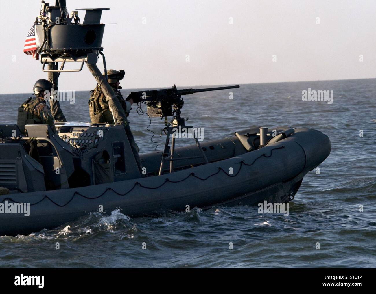 0809034500G-371 PINEY ISLAND, N.C. (Sept. 3, 2008) A Special Warfare Combatant-craft Crewman (SWCC) fires a .50-caliber machine gun from a Naval Special Warfare 11-meter rigid-hull inflatable boat during a live-fire training exercise in the Pamlico Sound. SWCC from Special Boat Team 20 spent the day conducting drills while firing .50-caliber machine guns and MK-19 grenade launchers preparing for an upcoming deployment supporting the Global War on Terrorism. Navy Stock Photo