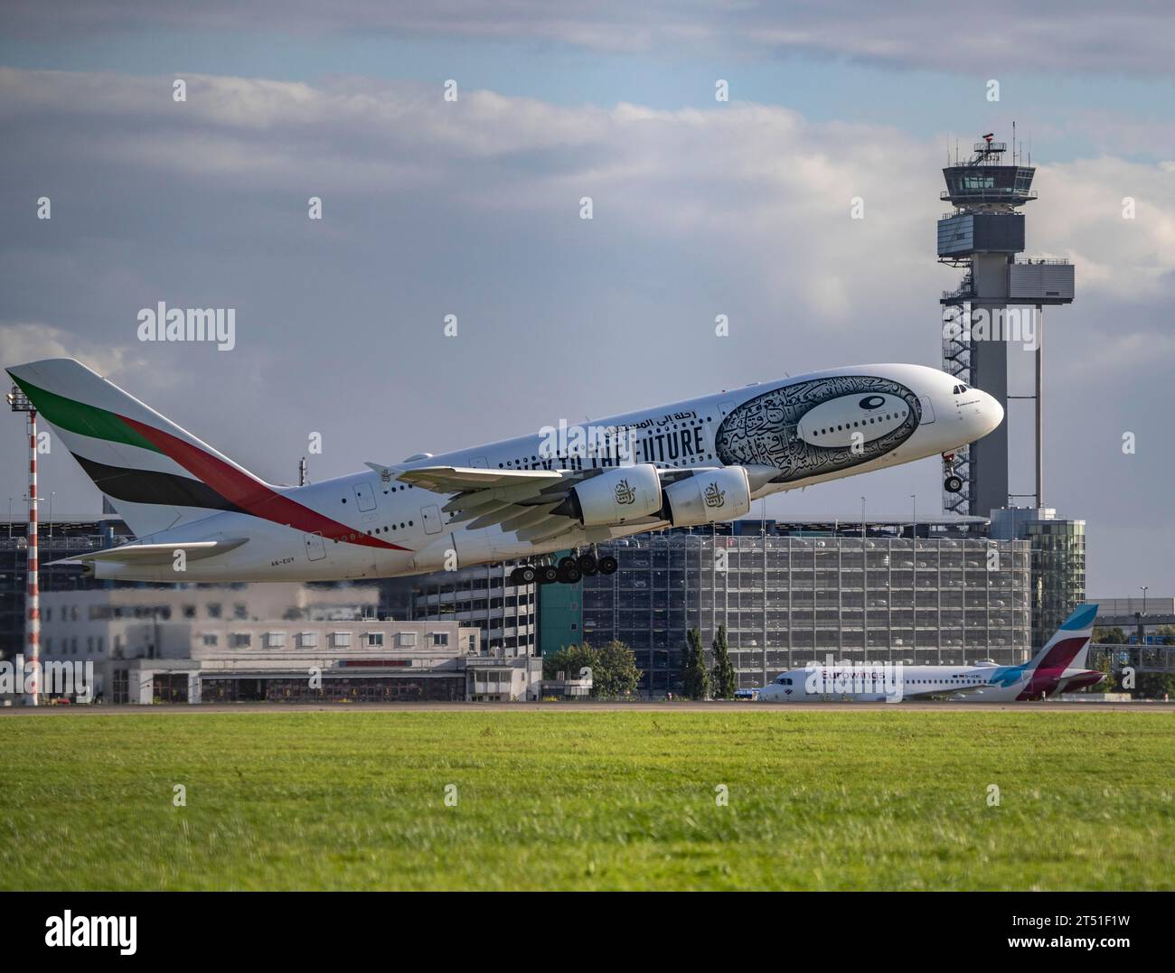 Emirates, Airbus A380-800, A6-EUT, taking off at Düsseldorf International Airport, air traffic control tower. Stock Photo