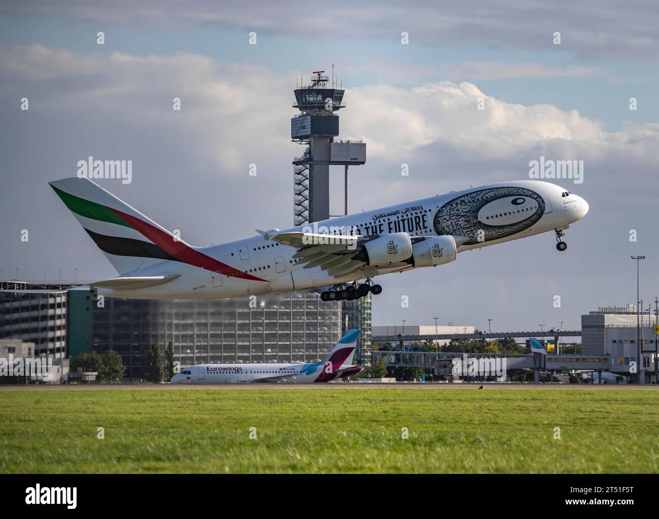Emirates, Airbus A380-800, A6-EUT, taking off at Düsseldorf International Airport, air traffic control tower. Stock Photo