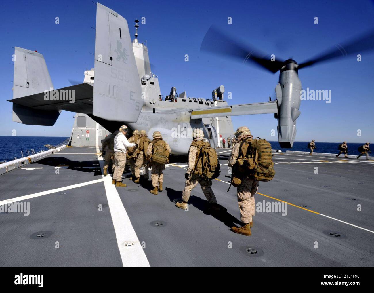 1004152147L-001 ONSLOW BAY, N.C. (April 15, 2010) Marines assigned to India Company, 3rd Battalion, 9th Marine Regiment board an MV-22 Osprey aboard the amphibious transport dock ship USS New York (LPD 21). New York is underway conducting training exercises in the Atlantic Ocean. Navy Stock Photo