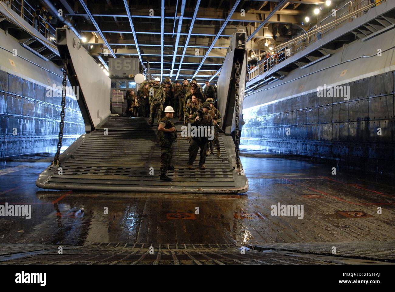 0706264614W-084 CORAL SEA (June 26, 2007) - Members of the 3d Marine Expeditionary BrigadeХs 31st Marine Expeditionary Unit prepare to enter a landing craft utility of Assault Craft Unit (ACU) 1 at the concluding stages of Talisman Saber 2007 (TS07). TS07 is a biennial U.S. and Australian-led Joint Task Force exercise designed to prepare both nations for crisis action planning and execution of contingency operations. TS07 maintains a high level of interoperability between both forces, demonstrating commitment to regional security and the U.S. and Australian military alliance. U.S. Navy Stock Photo