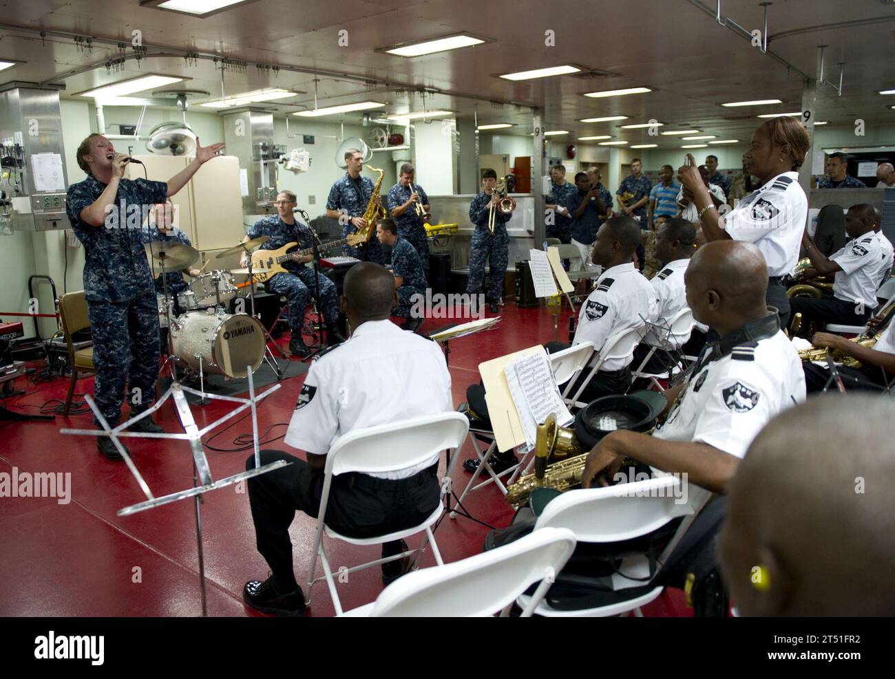 110829RM525-014 PORT-AU-PRINCE, Haiti (Aug. 29, 2011) The U.S. Fleet Forces Band performs for the Haitian Police Band aboard the Military Sealift Command hospital ship USNS Comfort (T-AH 20) during Continuing Promise 2011. Continuing Promise is a five-month humanitarian assistance mission to the Caribbean, Central and South America. Navy Stock Photo