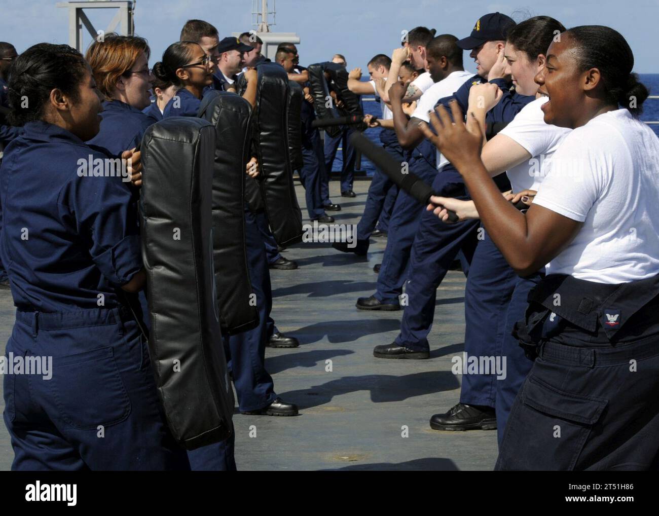 0910127478G-211 PACIFIC OCEAN (Oct. 12, 2009) Sailors participate in a reactionary force non-lethal weapons class aboard the amphibious command ship USS Blue Ridge (LCC 19). Navy Stock Photo