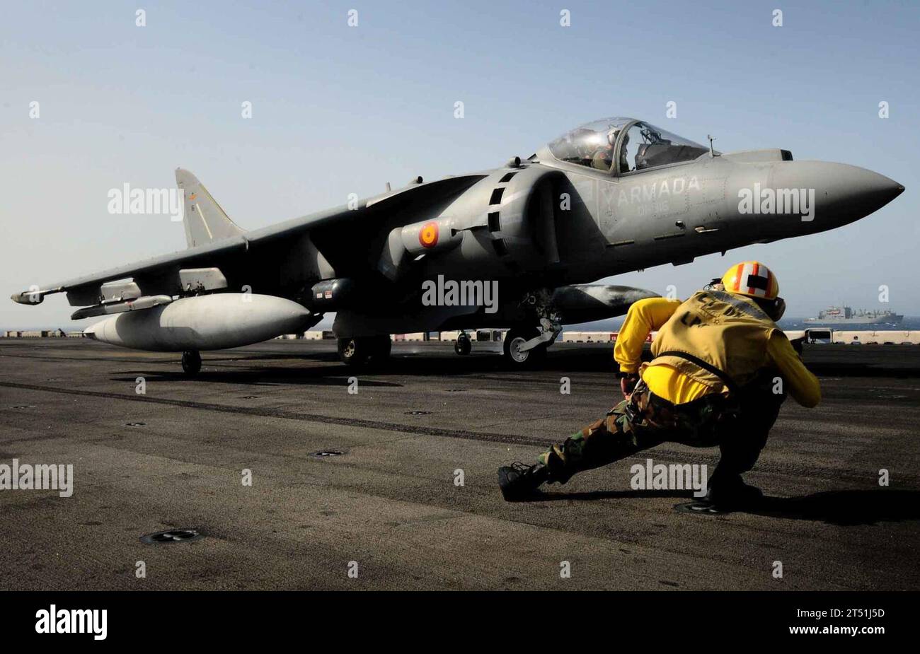 110625EC658-023 ATLANTIC OCEAN (June 25, 2011) A Sailor conducts final pre-flight checks on an AV-8B Harrier assigned to the 9th Spanish Harrier Squadron (9 FS) prior to launching aboard the multipurpose amphibious assault ship USS Bataan (LHD 5). Bataan is the command ship of the Bataan Amphibious Ready Group participating in the bilateral Spanish Amphibious Landing Exercise 2011 off the coast of Spain. Navy Stock Photo